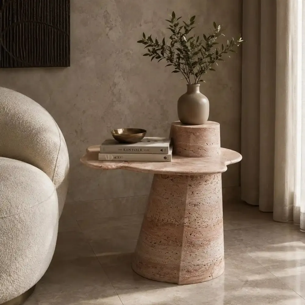 Rose travertine pedestal side table with a smaller stone stacked on top
