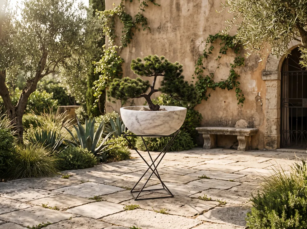 White marble bowl planter on a steel stand